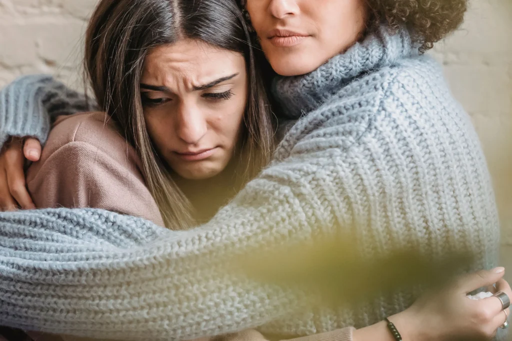 A woman hugging her friend
