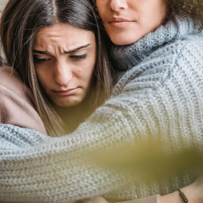 A woman hugging her friend