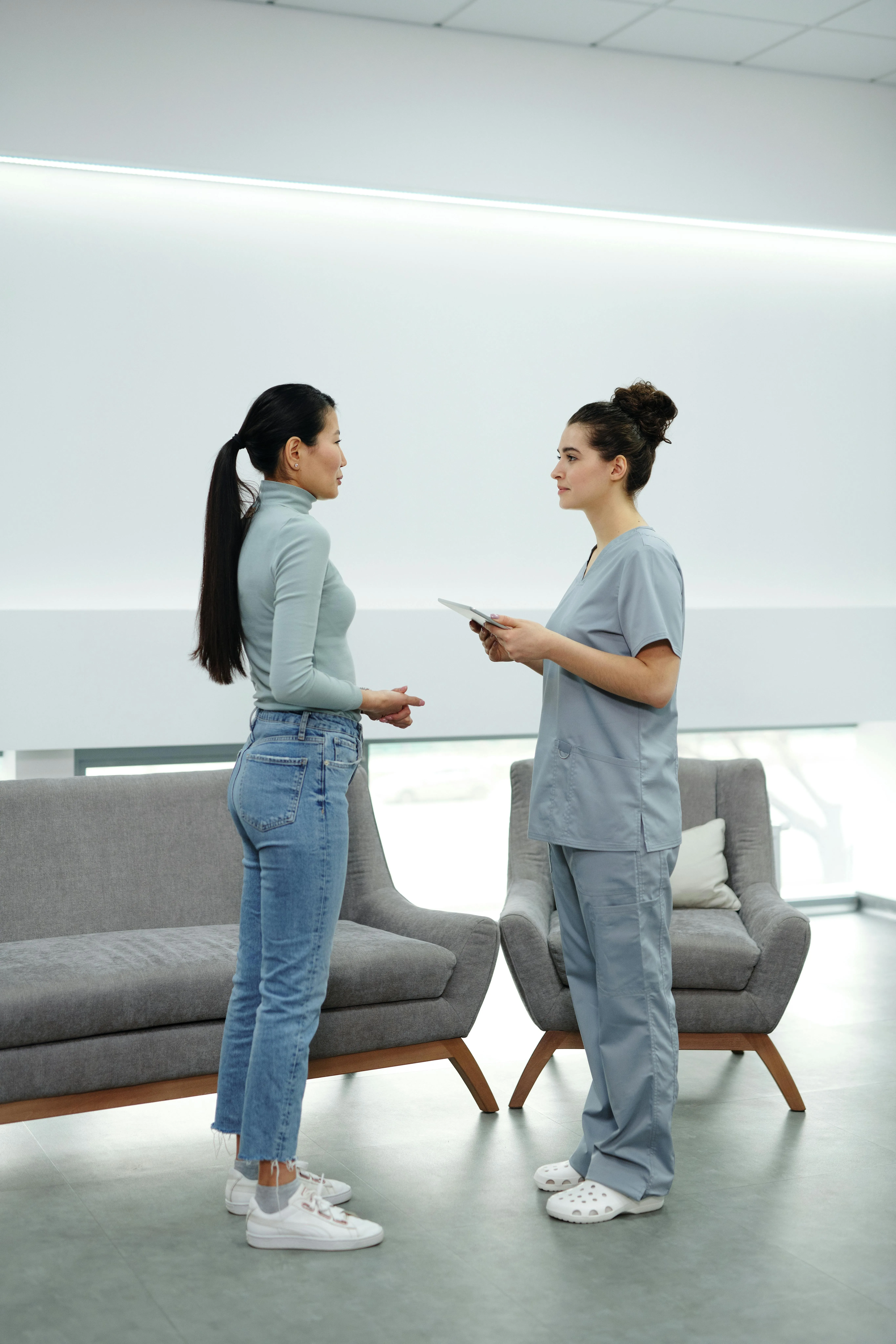 A woman speaking to a doctor