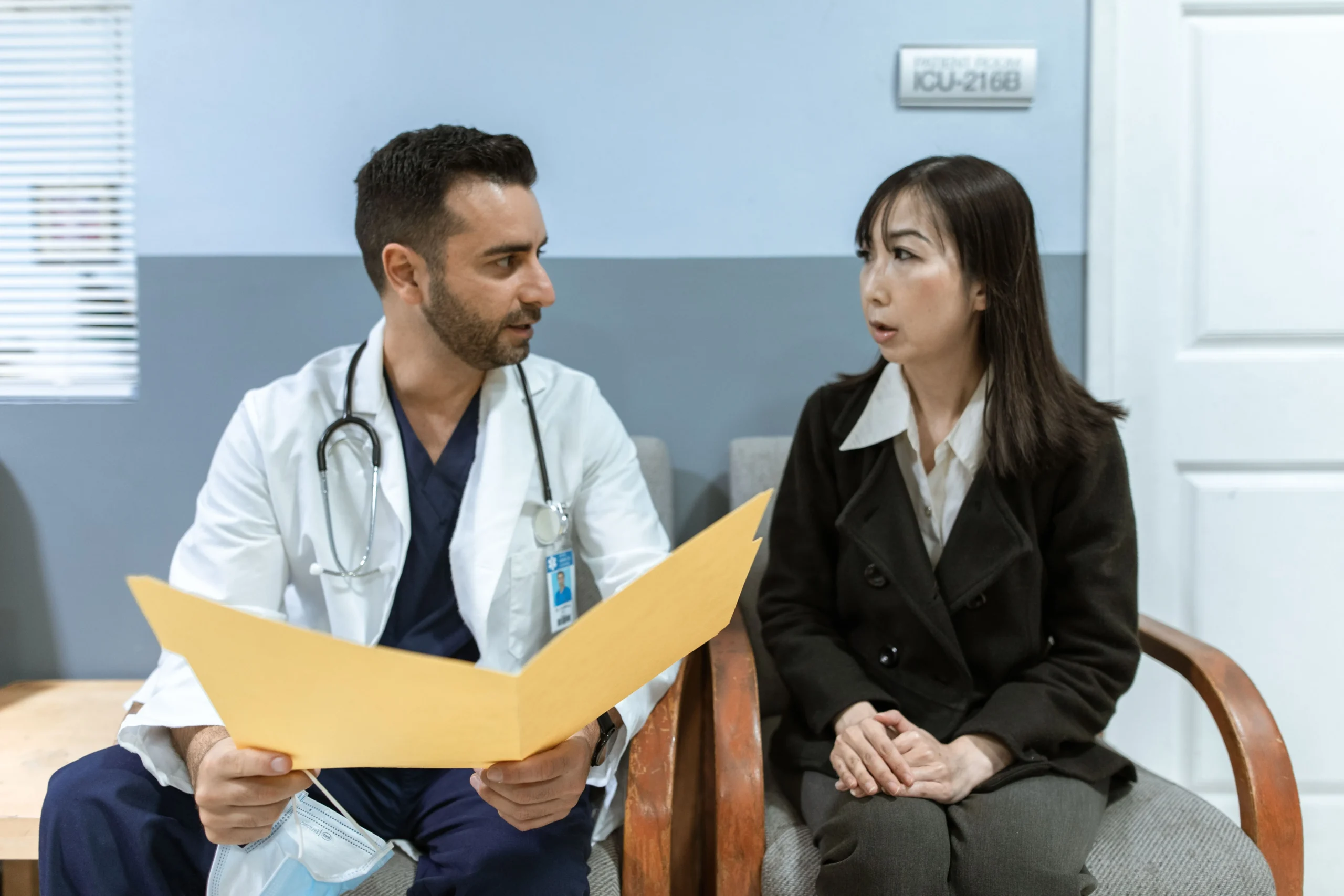 A doctor speaking to a patient