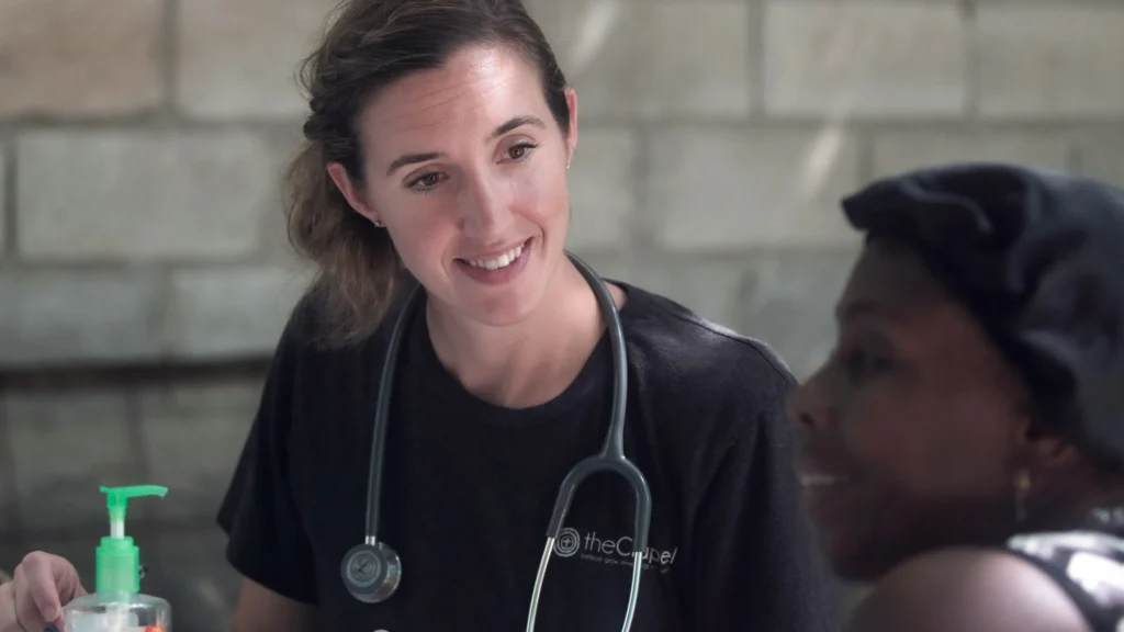 A doctor smiling at a patient