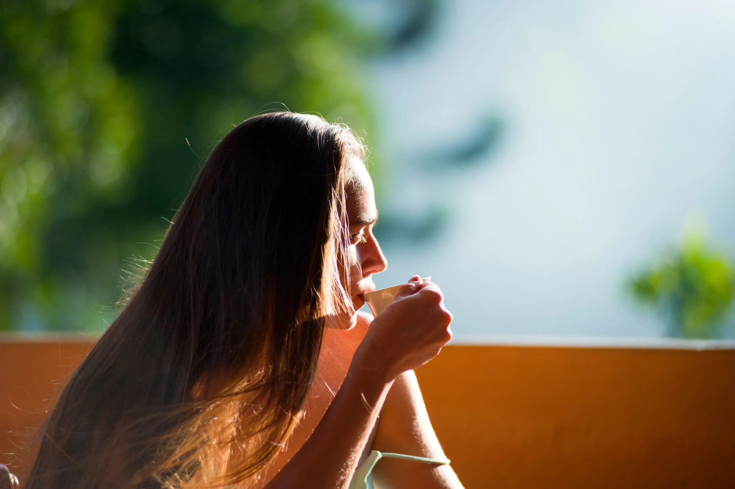 A woman relaxing and drinking tea