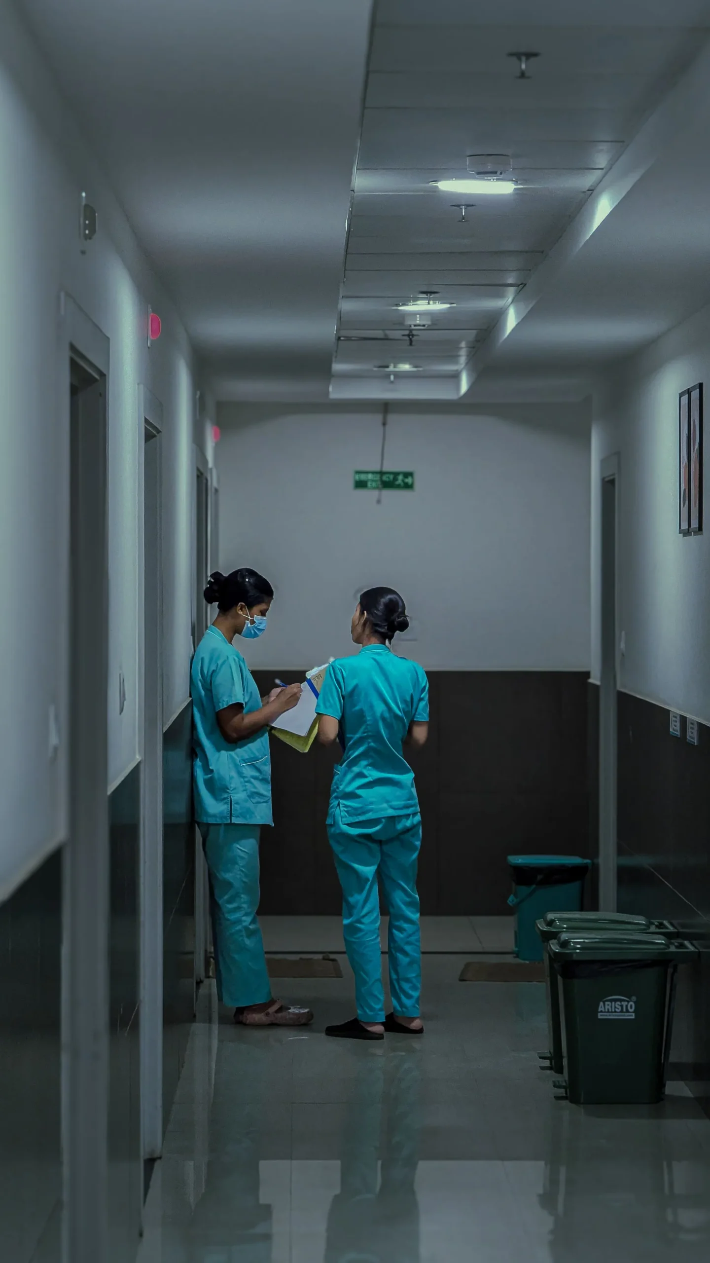 Nurses standing outside an operation theatre
