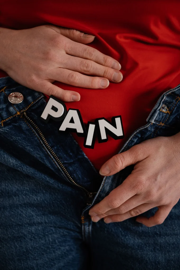 A woman holding her stomach in pain