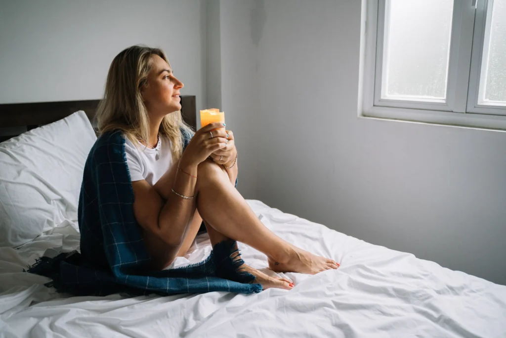A woman resting in bed