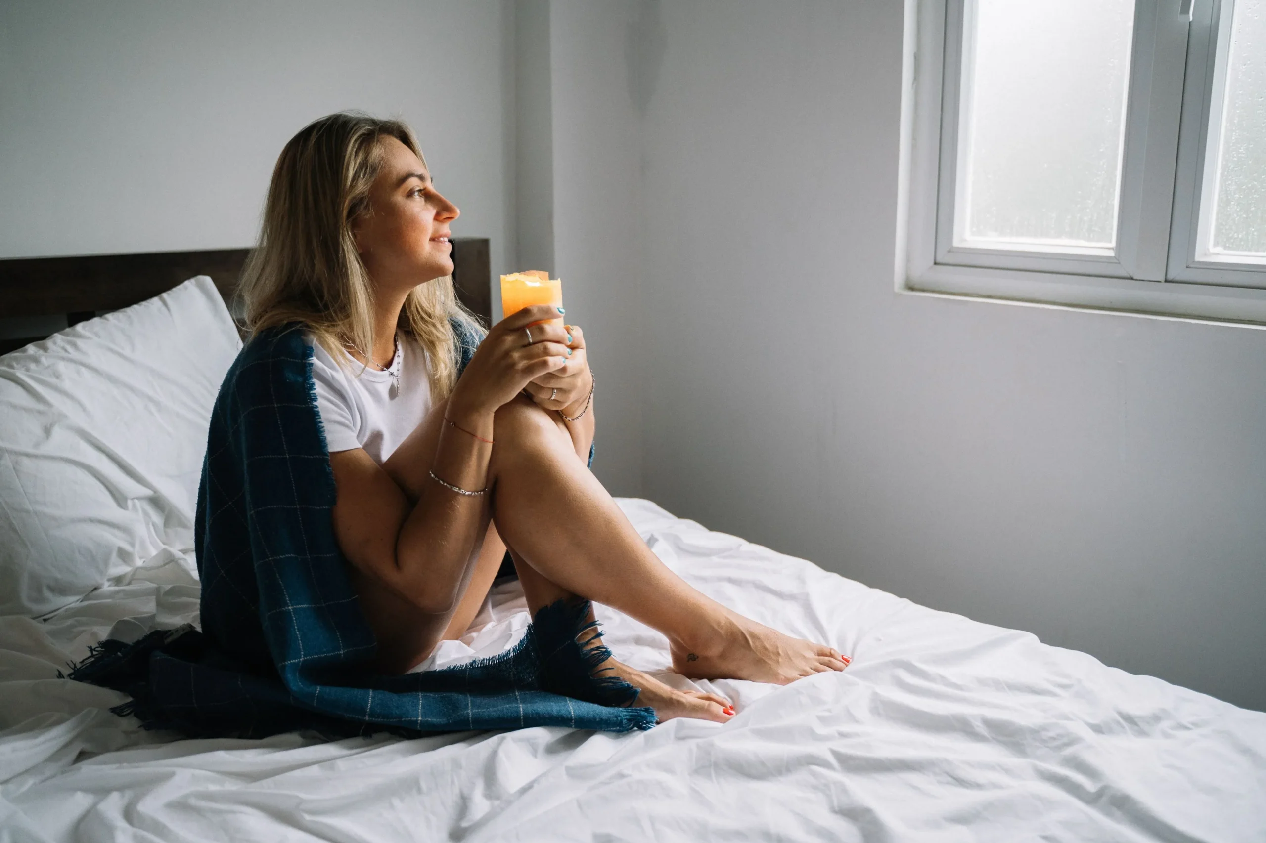 A woman resting in bed