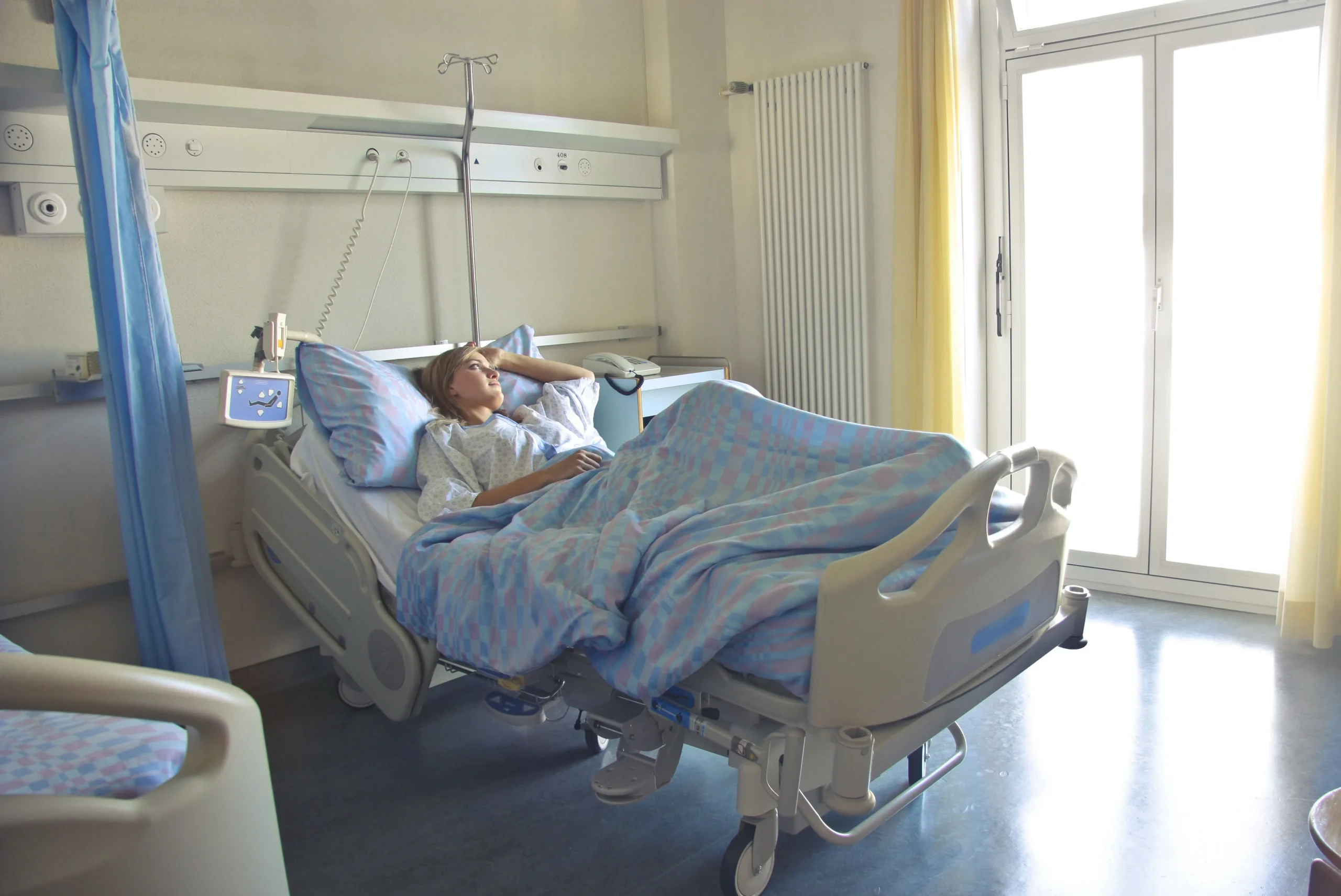 A woman resting in the hospital bed
