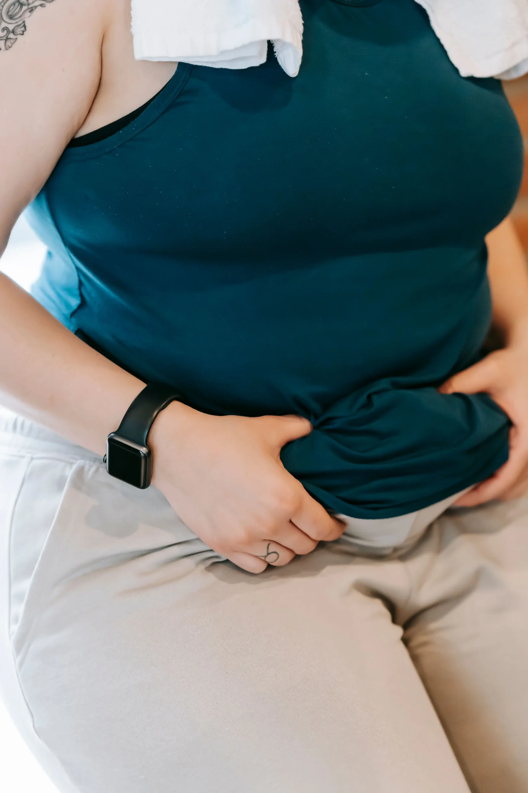 A woman holding her stomach