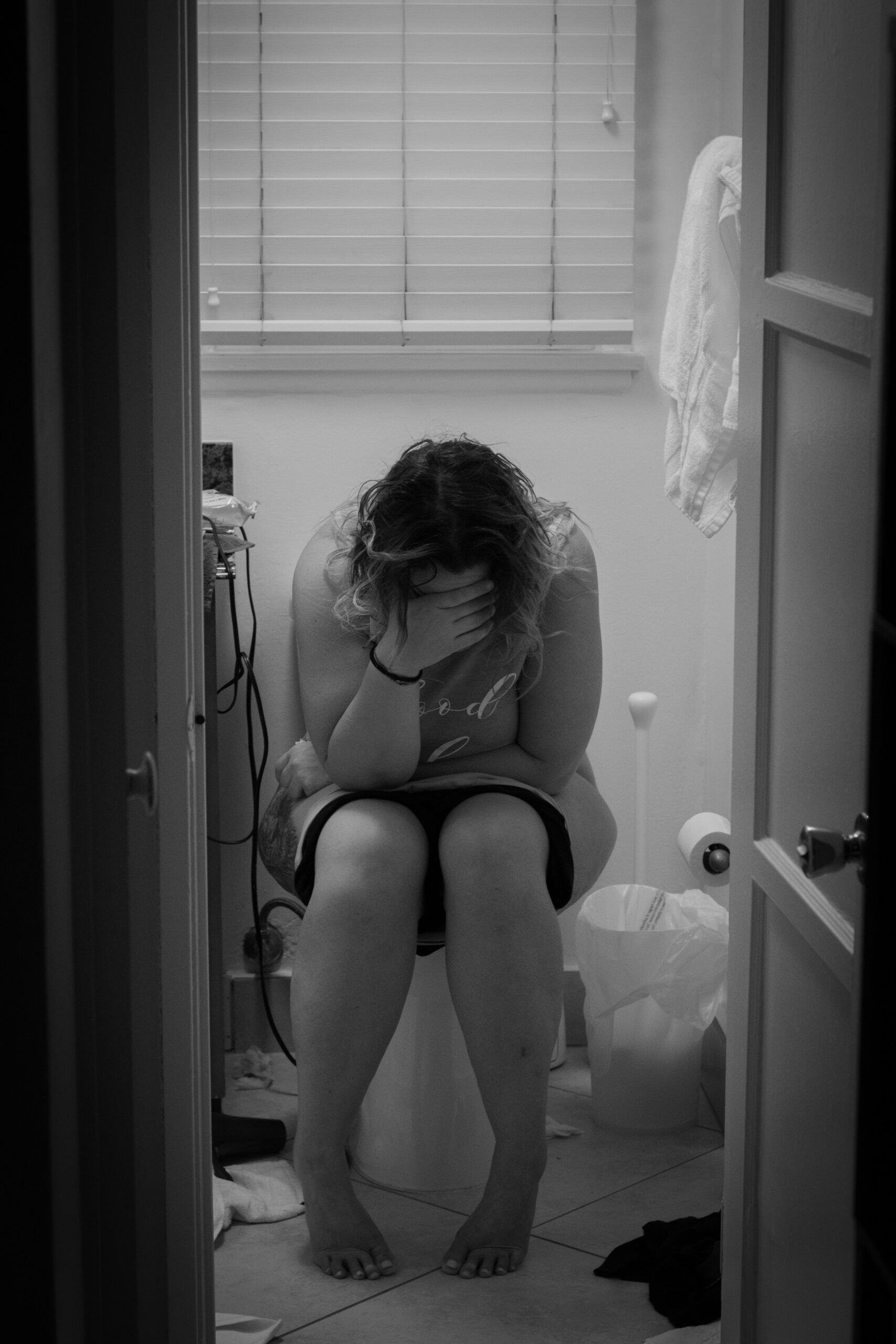 a woman in the bathroom stressed out
