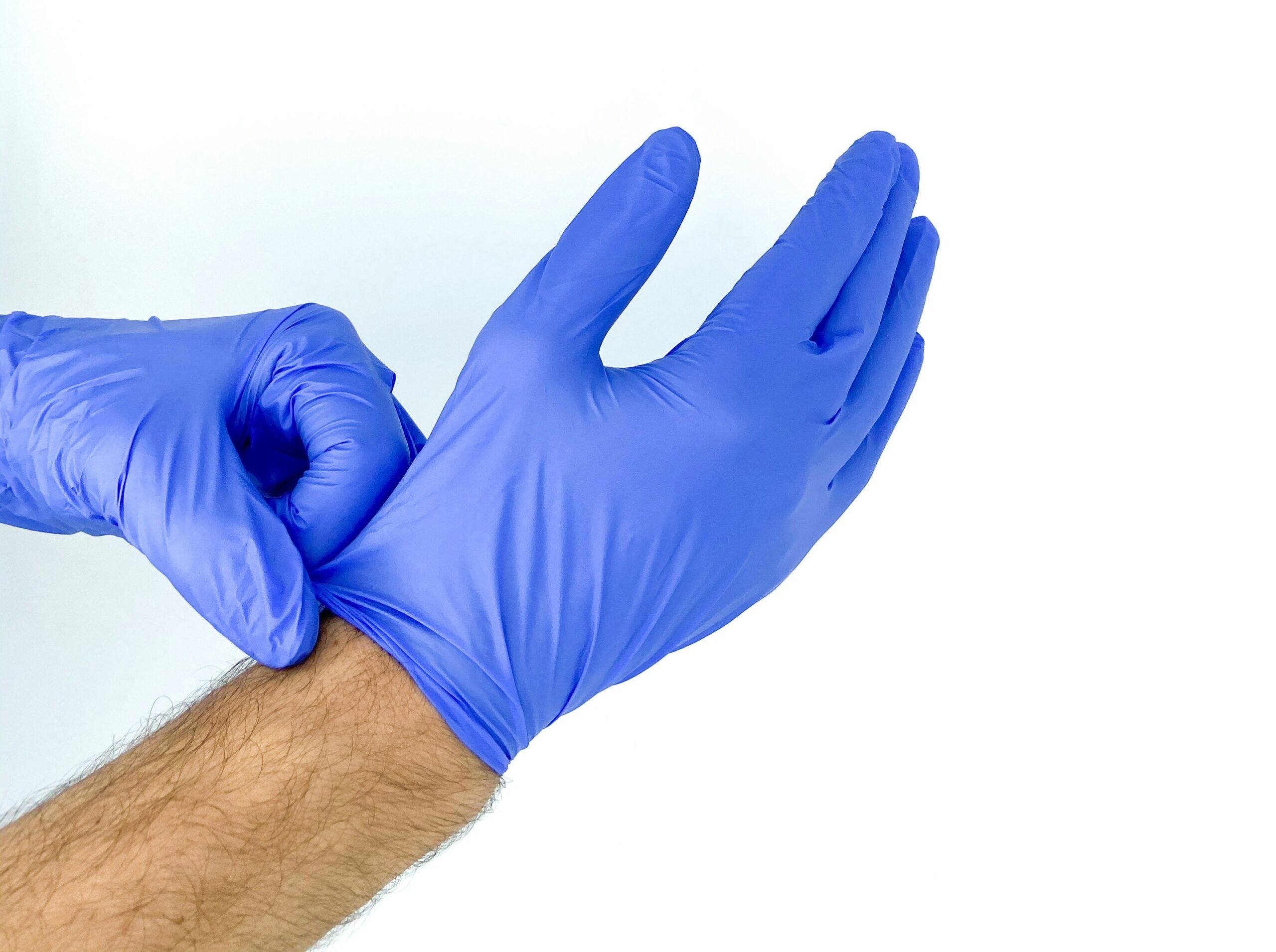 a doctor putting on gloves