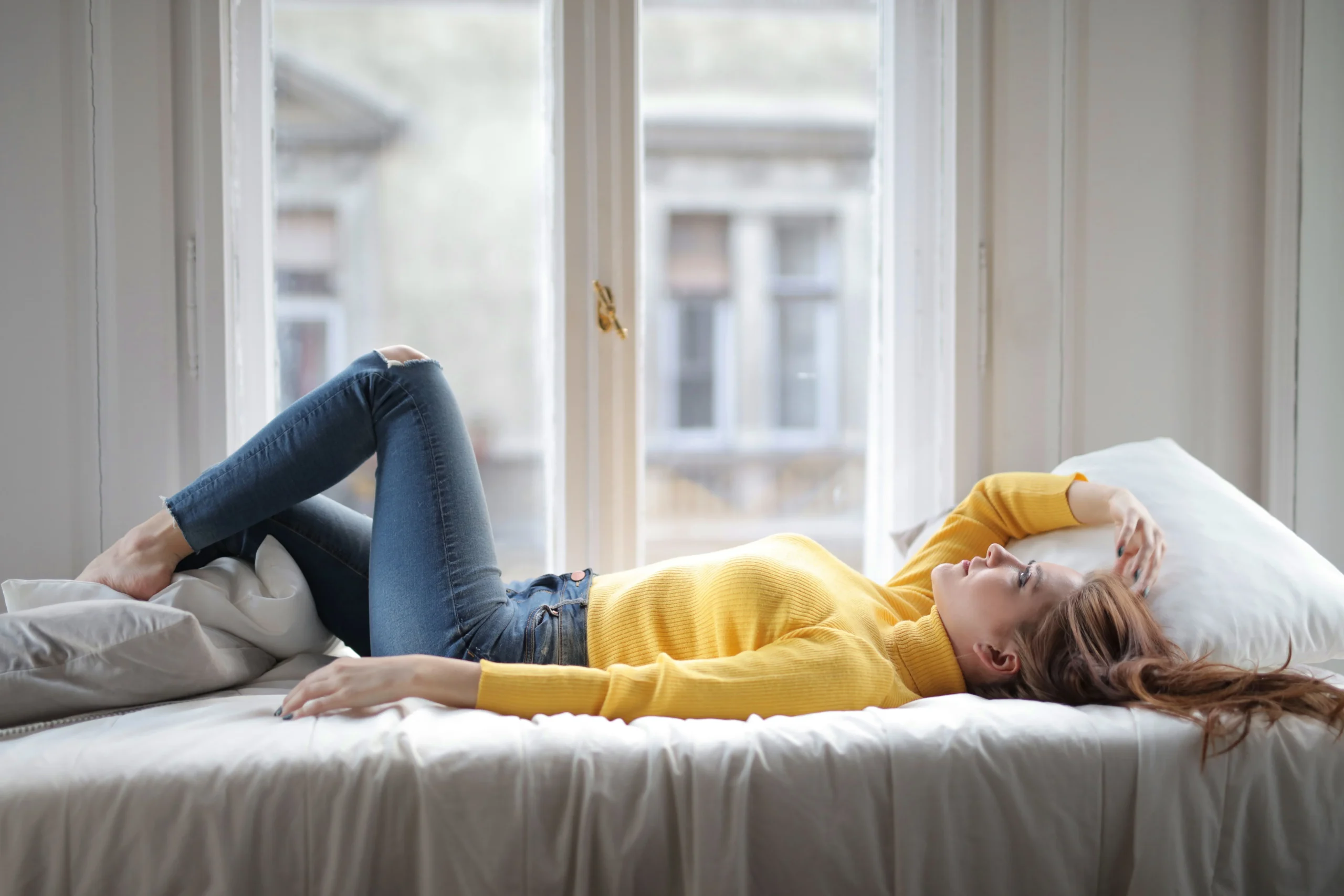 5493895b 9359 4ff9 b6c9 f8e5a31d6f26webp - Endometriosis Center of Excellence A woman in bed recovering from endometriosis surgery