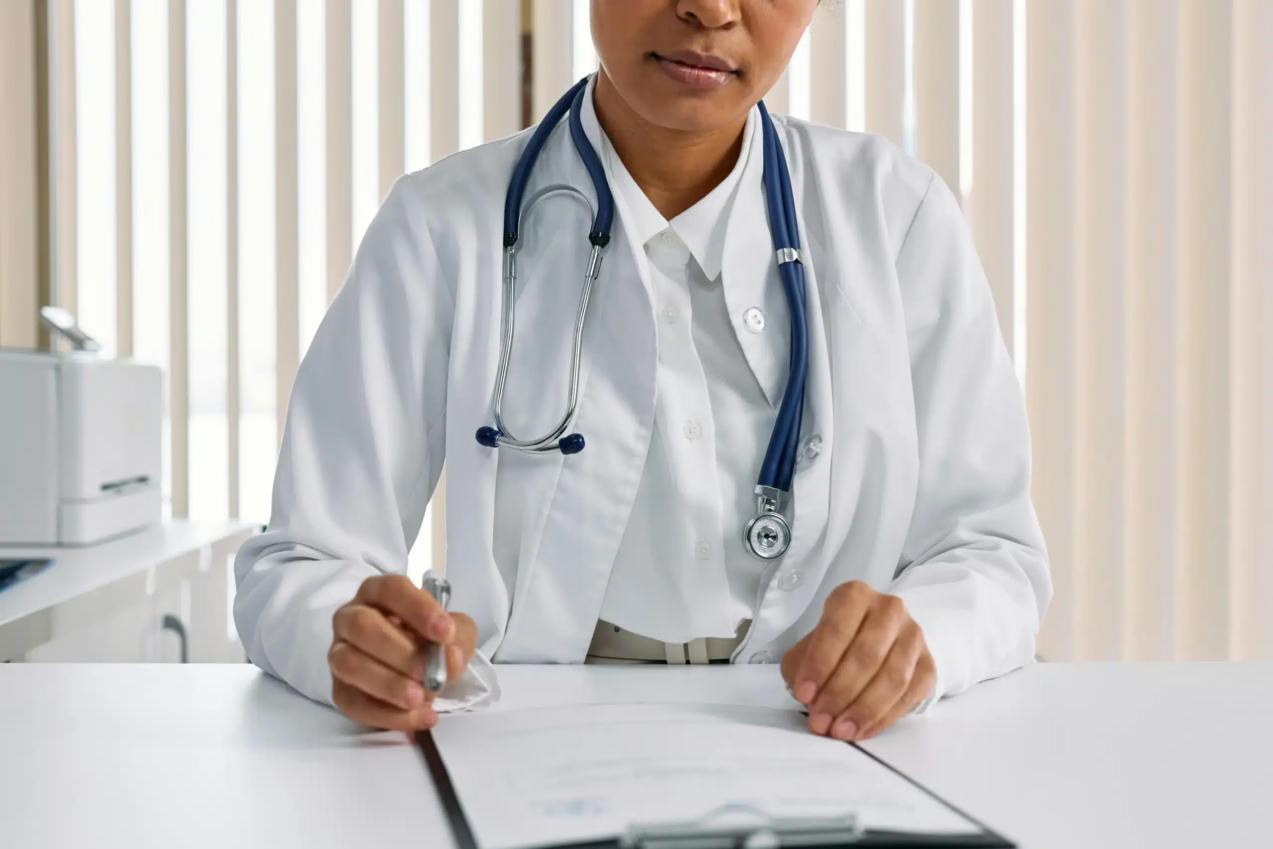 A doctor taking patient notes