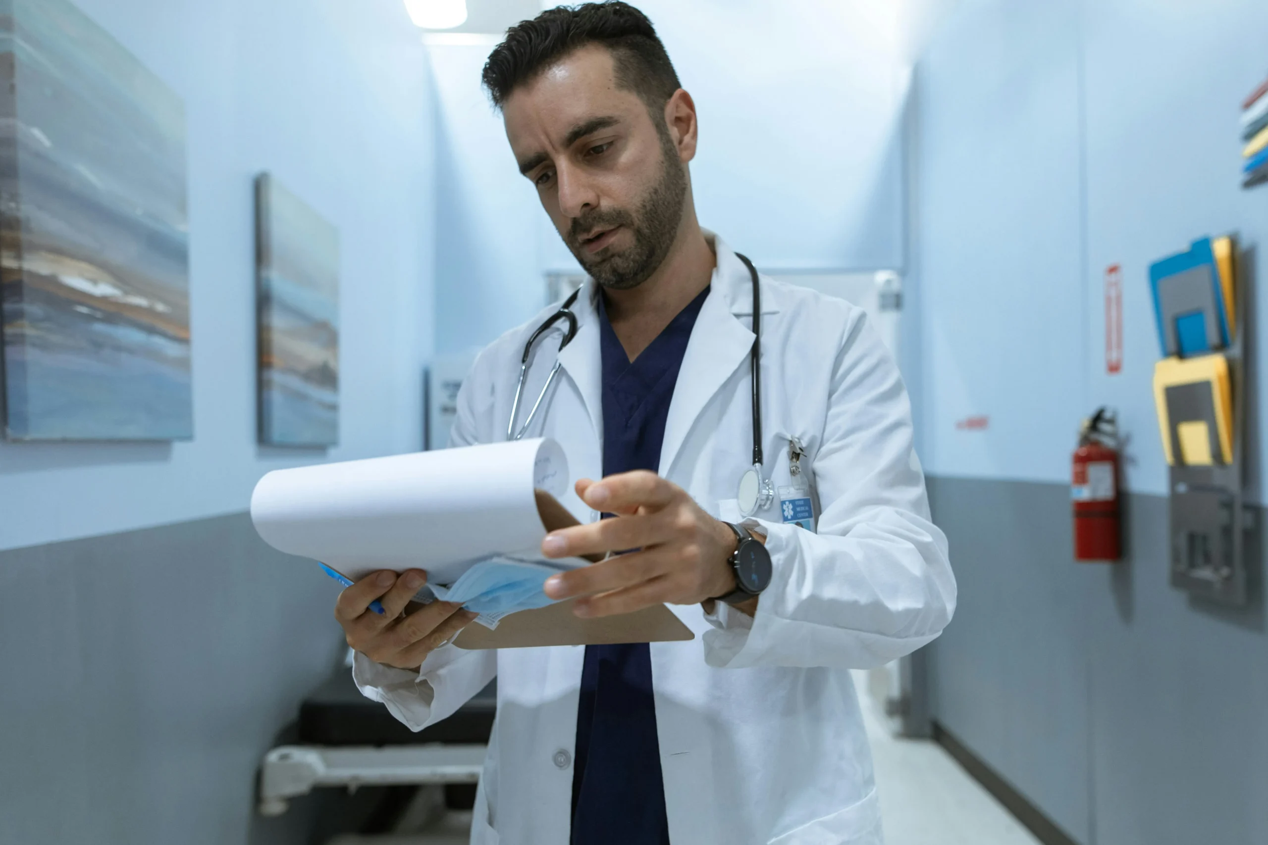 A doctor reading test reports