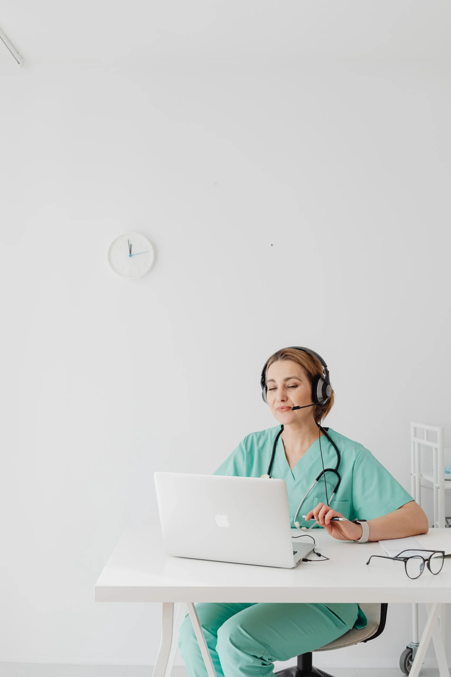 A doctor on a phonecall wearing headphones
